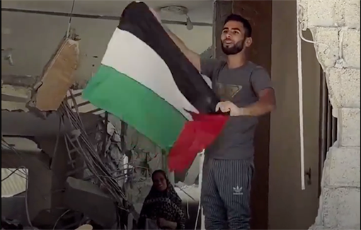 Thumbnail preview image for the video titled: Palestinian man defiantly raises the flag above the ruins of his severely damaged home