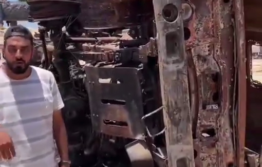 Thumbnail preview image for the video titled: Children playing with remains of a vehicle