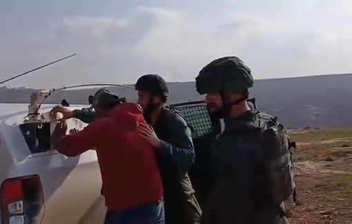 Thumbnail preview image for the video titled: Uniformed settlers from the Mitzpe Yair outpost invaded the village of Qawawis and abducted a resident