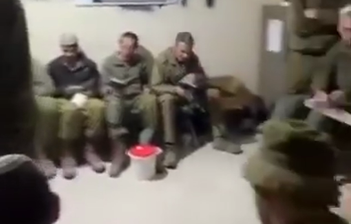 Thumbnail preview image for the video titled: Israeli soldiers hold a Purim megillah reading inside a squatted Palestinian house