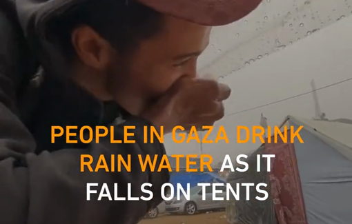 Thumbnail preview image for the video titled: Dehydrated Palestinians in Gaza drink rainwater that falls on tent shelters