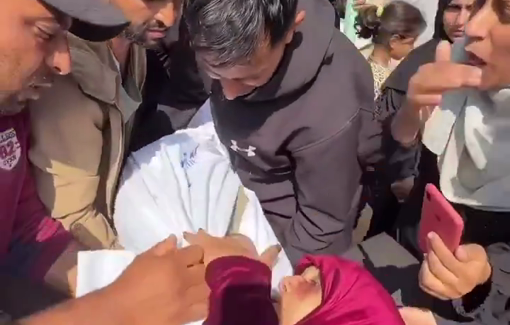 Thumbnail preview image for the video titled: Wounded mother kisses her killed son goodbye after Israel bombed their house at night