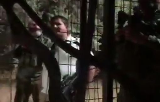 Thumbnail preview image for the video titled: Armed settlers, including soldiers, came at night to intimidate Issa Amro for speaking to international media about occupation crimes