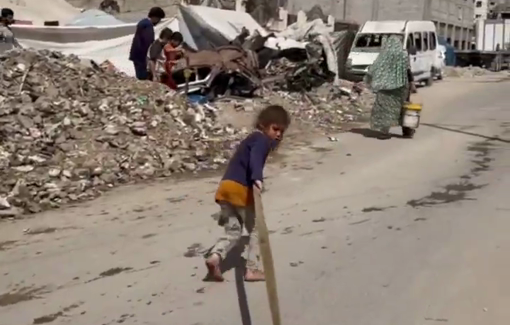 Thumbnail preview image for the video titled: Little girl struggling to pull water containers