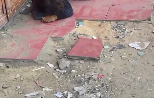 Thumbnail preview image for the video titled: Exhausted child sleeps on pavement, barefoot and hungry