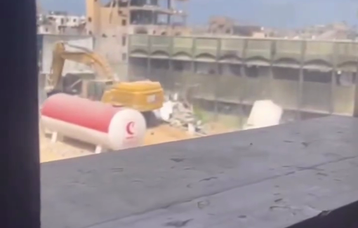 Thumbnail preview image for the video titled: Israeli heavy machinery demolishing buildings around the Indonesian Hospital