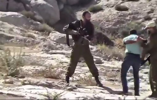 Thumbnail preview image for the video titled: Settlers wearing green uniforms brutally attacked a Palestinian resident in the village of Qawawis