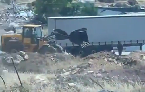 Thumbnail preview image for the video titled: Israeli bulldozer creating an earth berm to block a road in Hizma, Jerusalem Governorate.