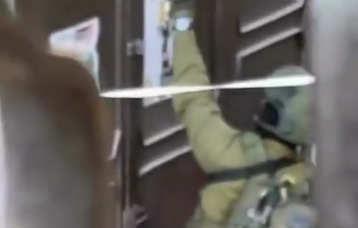 Thumbnail preview image for the video titled: Isareli soldiers desecrate martyrs' photographs inside Balata camp by tearing down them