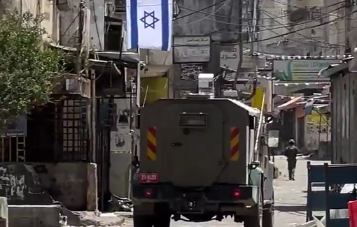 Thumbnail preview image for the video titled: Israeli forces raise the israeli flag during their ongoing raid on Balata camp