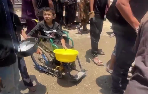 Thumbnail preview image for the video titled: Wheelchair-bound child struggles to get food from soup kitchen