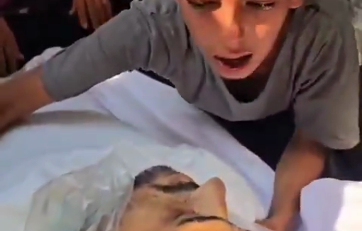 Thumbnail preview image for the video titled: A child mourns his father who was killed while seeking aid