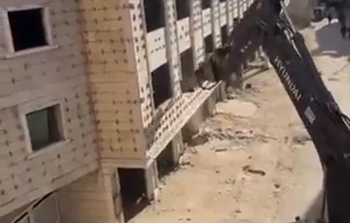 Thumbnail preview image for the video titled: Hyundai Israeli excavator demolishes Palestinian residential buildings under construction in the occupied Jerusalem