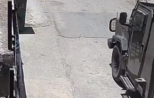 Thumbnail preview image for the video titled: Israeli occupation soldiers chase behind a Palestinian boy to remove a flag of Palestine from his bike, in the village of Deir Qiddis,