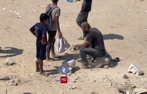 Thumbnail preview image for the video titled: Father and children sift flour mixed with sand in northwest Gaza