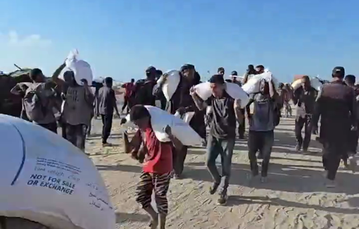 Thumbnail preview image for the video titled: Child carries heavy flour bag over his small shoulder all the way from Zikim