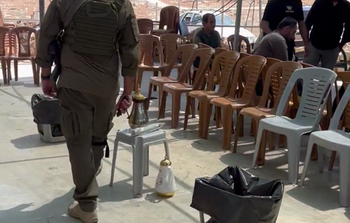 Thumbnail preview image for the video titled: Israeli solders raid the mourning tent for Awdah Hathaleen in Umm Al Khair