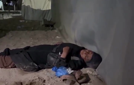 Thumbnail preview image for the video titled: Forcibly displaced woman sleeps on the street