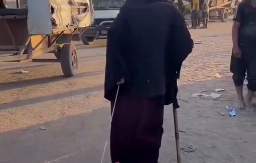 Thumbnail preview image for the video titled: Displaced by Israeli bombing, elderly woman drags her chair along with a small bag