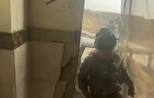 Thumbnail preview image for the video titled: IDF soldiers bring in a Torah scroll into Gaza disguised as tank shell casing