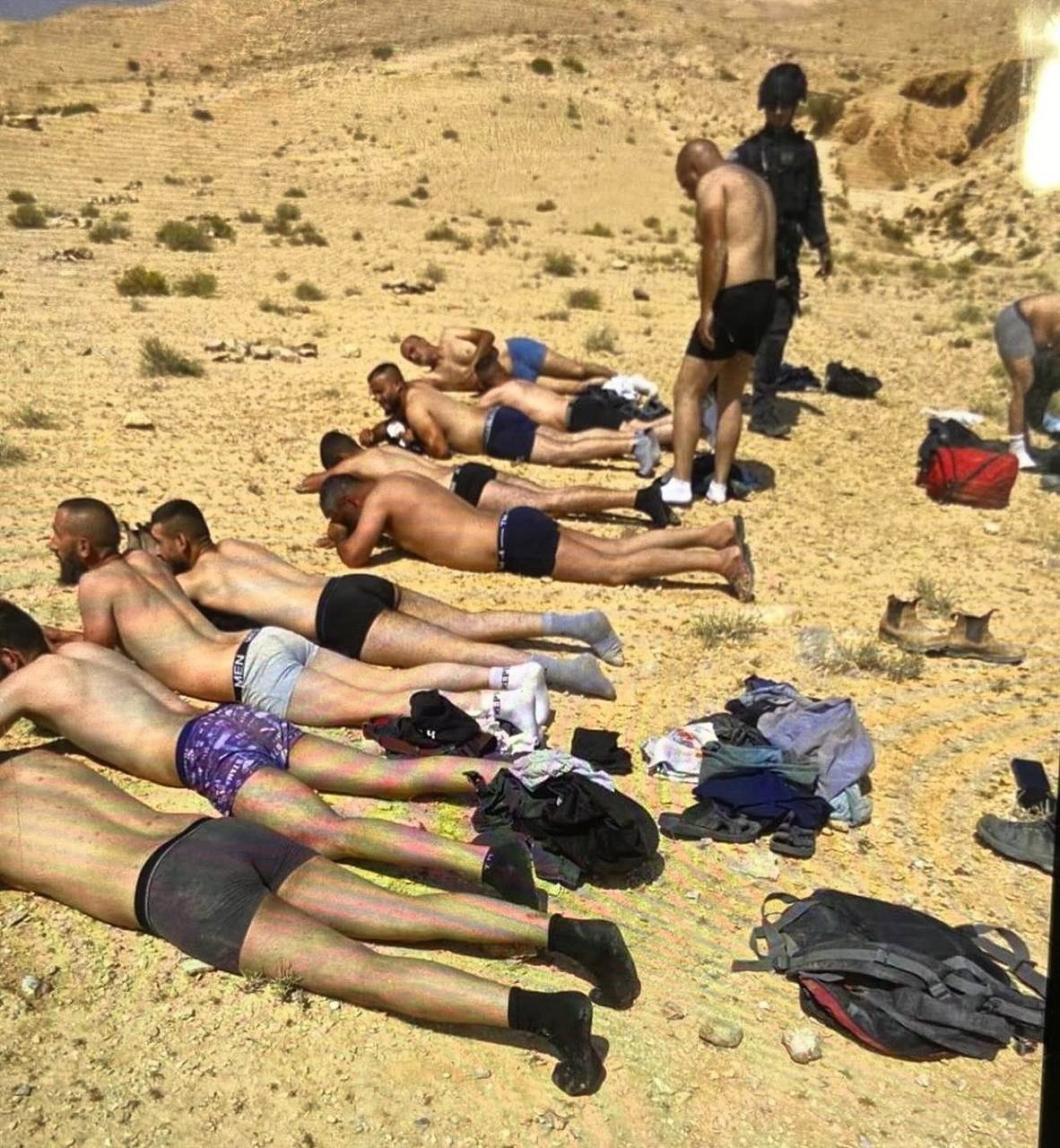 Thumbnail preview image for the video titled: Palestinian workers handcuffed and blindfolded, and forced by occupation soldiers to take off their clothes, in the Wadi Sayyal area