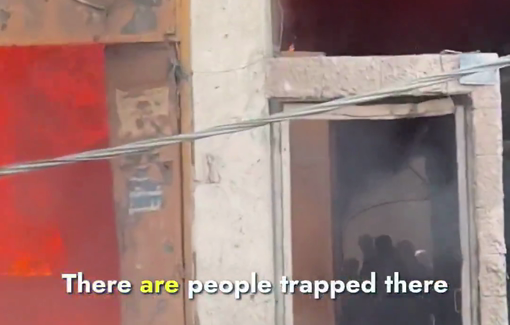 Thumbnail preview image for the video titled: Displaced people trapped in burning buildings after Israel bombed the area
