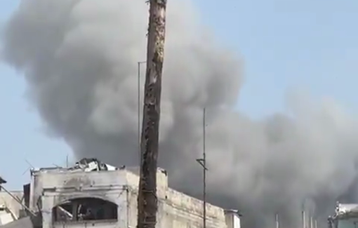 Thumbnail preview image for the video titled: Smoke rises from the Qalaja family house following an Israeli airstrike
