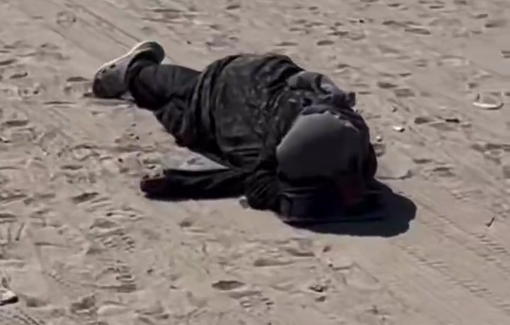 Thumbnail preview image for the video titled: Woman lies on the ground, exhausted from displacement