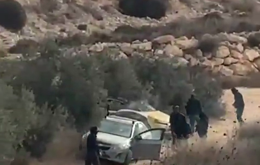 Thumbnail preview image for the video titled: Settlers attack olive harvesters and torch two vehicles in Turmus Ayya