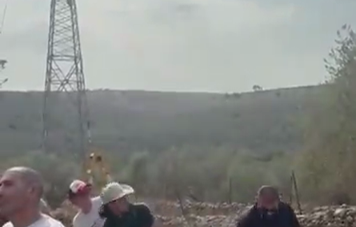 Thumbnail preview image for the video titled: An Israeli drone hits and injures an activist during an olive harvest near the Revava settlement in Deir Istiya