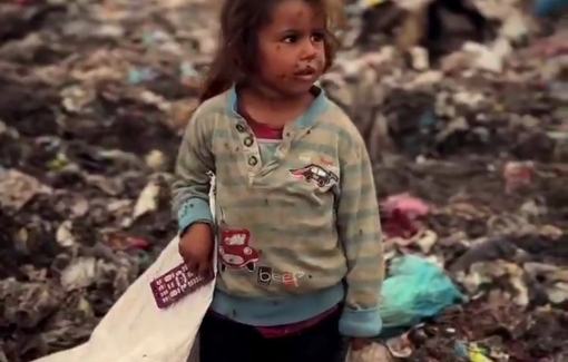 Thumbnail preview image for the video titled: Children scavenge through waste in a landfill for useful items