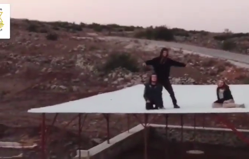 Thumbnail preview image for the video titled: Israeli Settler backed by soldiers attempting to 'settle' at a site not far from the town of Beerajam for the 8th light of Hanukkah