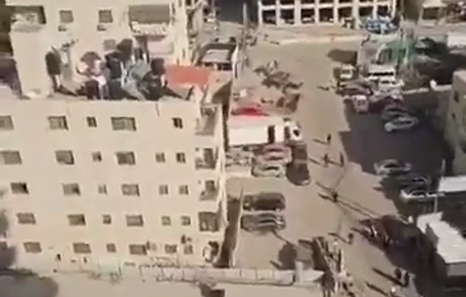 Thumbnail preview image for the video titled: Israeli soldiers throw a grenade at Palestinian women during a raid in Kafr ‘Aqab,