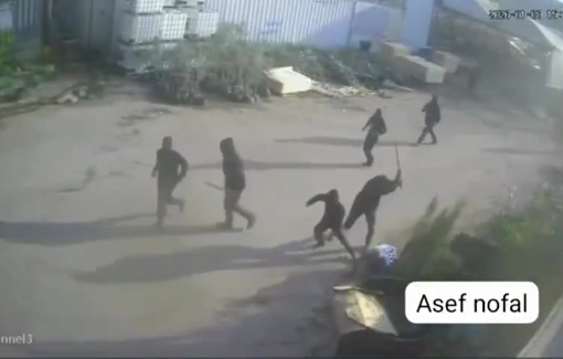 Thumbnail preview image for the video titled: Dozens of masked settlers brutally assaulted an elderly Palestinian in Deir Sharaf with sticks and boots