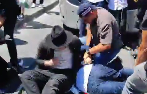 Thumbnail preview image for the video titled: Police officers beating demonstrators with batons at a protest against the conscription of Haredim in Jerusalem
