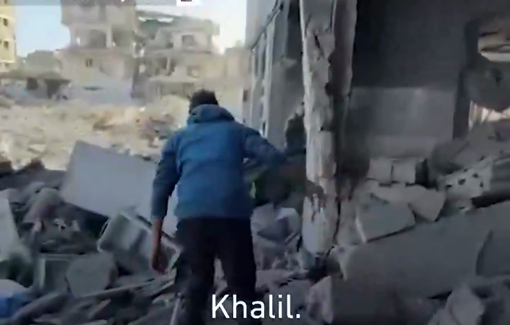 Thumbnail preview image for the video titled: Kamal Nasawi searches for his brother Twins Khalil amid the rubble of the Sheikh Radwan police station in Gaza
