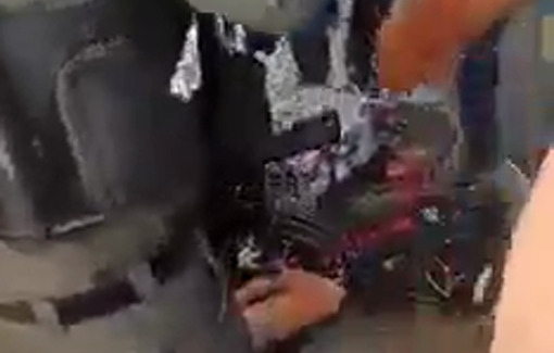 Thumbnail preview image for the video titled: Israeli Border Police unlawfully detains a Palestinian child for waving a flag on a bike