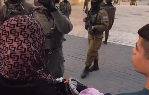 Thumbnail preview image for the video titled: Israeli soldiers forcibly stopped Palestinians to move and closed shops to allow the settlers saturday parade in Hebron/Al-Khalil