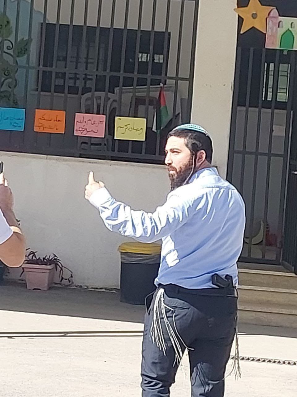 Thumbnail preview image for the video titled: MK Zvi Succot, with a pistol. threatening students in theLubban al-Sharqiya school near Nablus