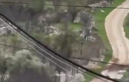 Thumbnail preview image for the video titled: Masked settlers tried to ram, beat, and throw rocks at unarmed residents in Halhul