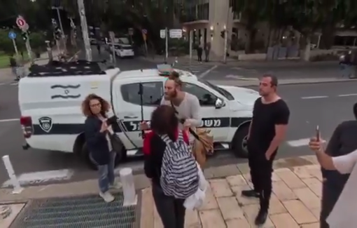 Thumbnail preview image for the video titled: Right wing influencer, Roi Star, backed by police, harasses anti-war protestors in Tel-Aviv