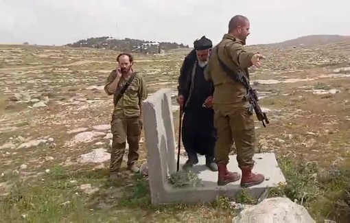 Thumbnail preview image for the video titled: In Khirbet al-Tawil, settlers disguised as soldiers trying to displace Palestinians and block them from grazing sheep on their land