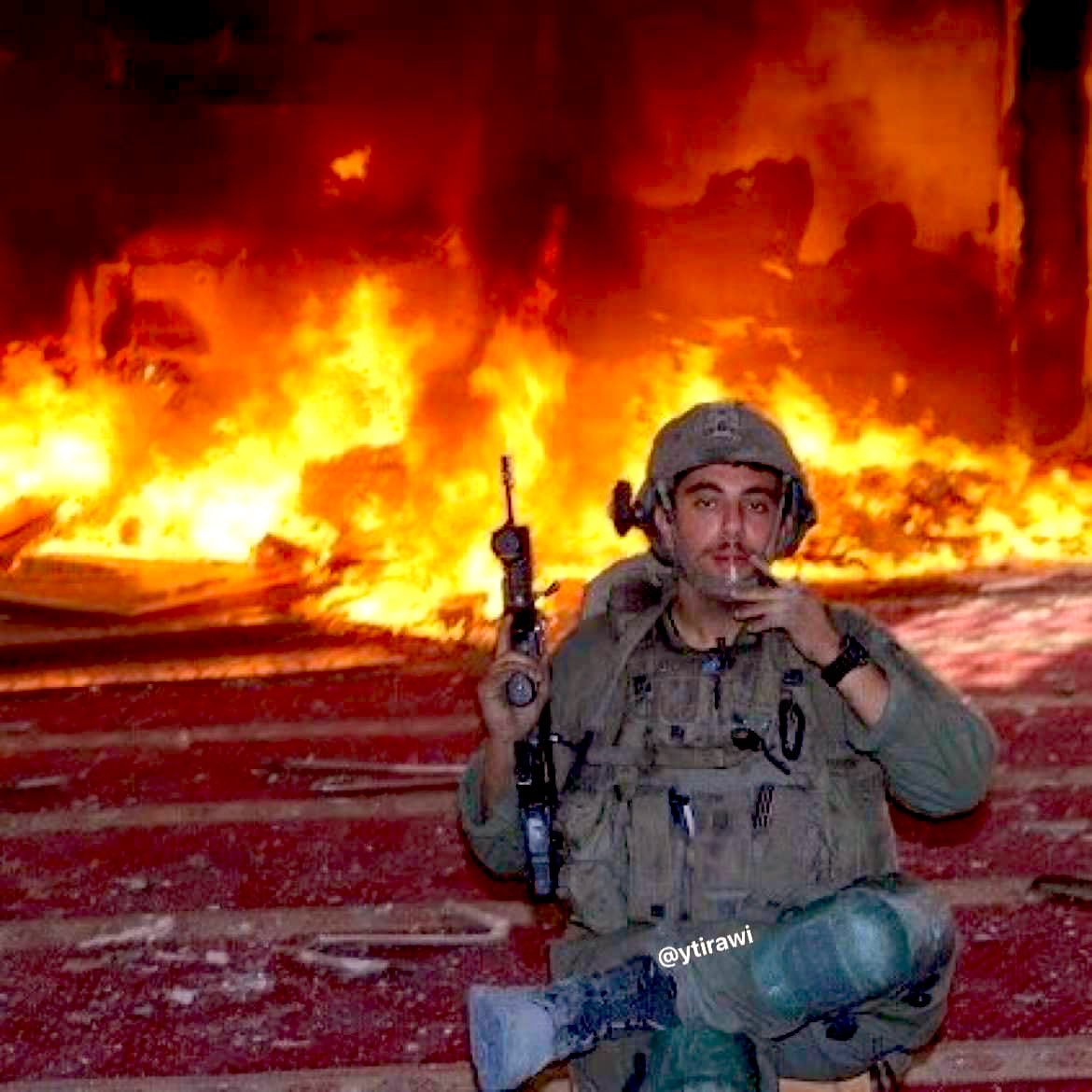 Thumbnail preview image for the video titled: IDF soldier poses proudly while torching a mosque in Rafah