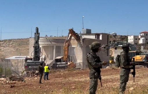 Thumbnail preview image for the video titled: Three Israeli excavators demolished a home and made an entire family homeless in Al-Deirat (Masafer)