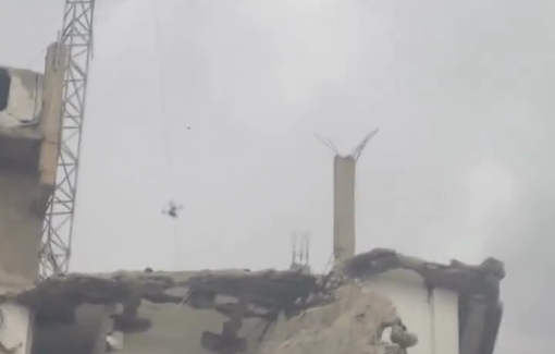 Thumbnail preview image for the video titled: Israeli drone drops an explosive on Al-Shawwa Tower in Gaza City