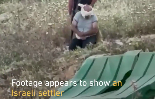 Thumbnail preview image for the video titled: An Israeli settler dragging a blindfolded and bound elderly Palestinian man into a road in the village of Beit Iksa