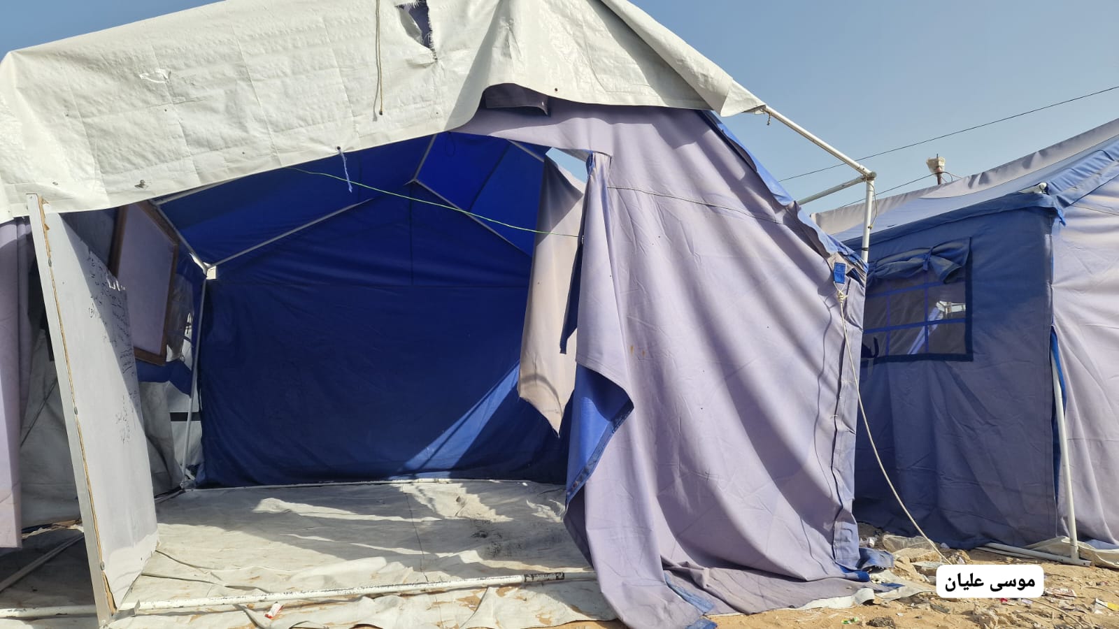 Thumbnail preview image for the video titled: Tents damaged by violent Israeli bombing of Al-Faluja area, North Gaza