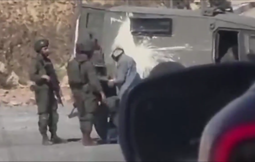 Thumbnail preview image for the video titled: Isreli forces cover a Palestinian man's head with a hood as they detain him at the entrance of Al-Mughayyir