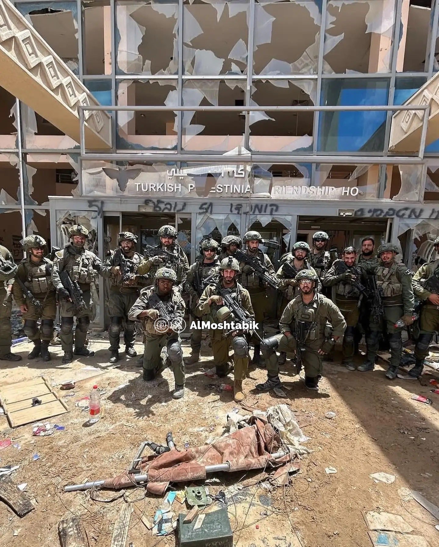 Thumbnail preview image for the video titled: IDF squad proudly poses at the fates of Gaza's only cancer hospital after using it as a base and destroying it