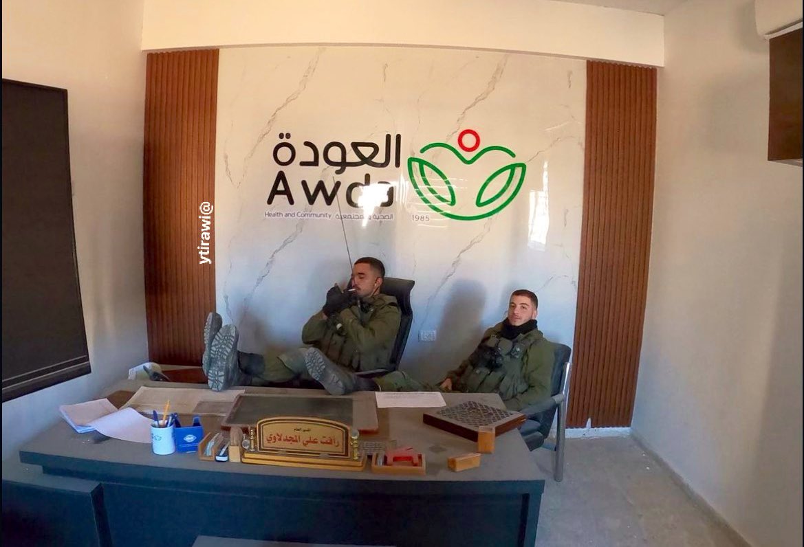 Thumbnail preview image for the video titled: IDF soldiers pose defiantly on the desk of Al-Awda hospital's director